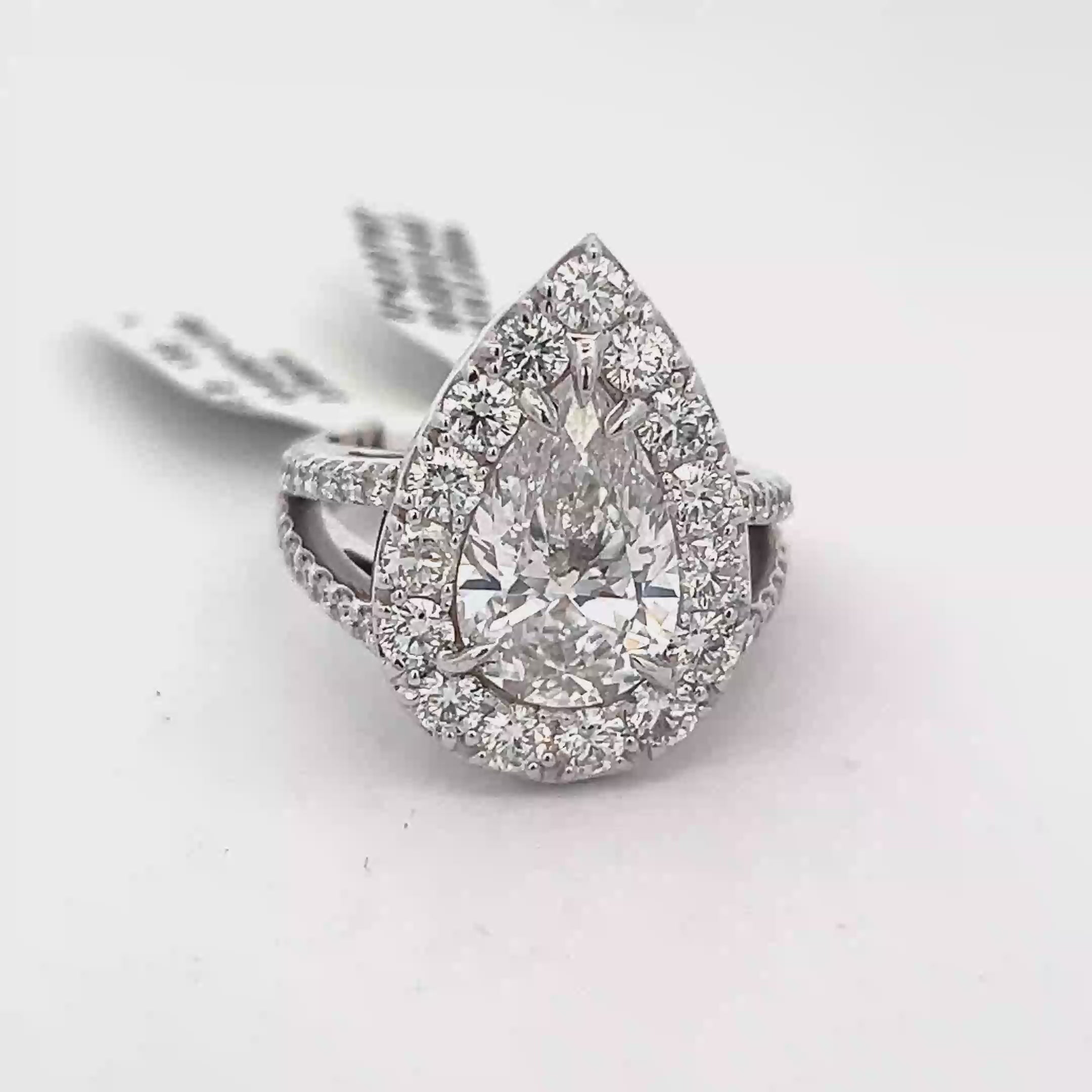 Pear Diamond in a Halo Setting with Round Diamonds