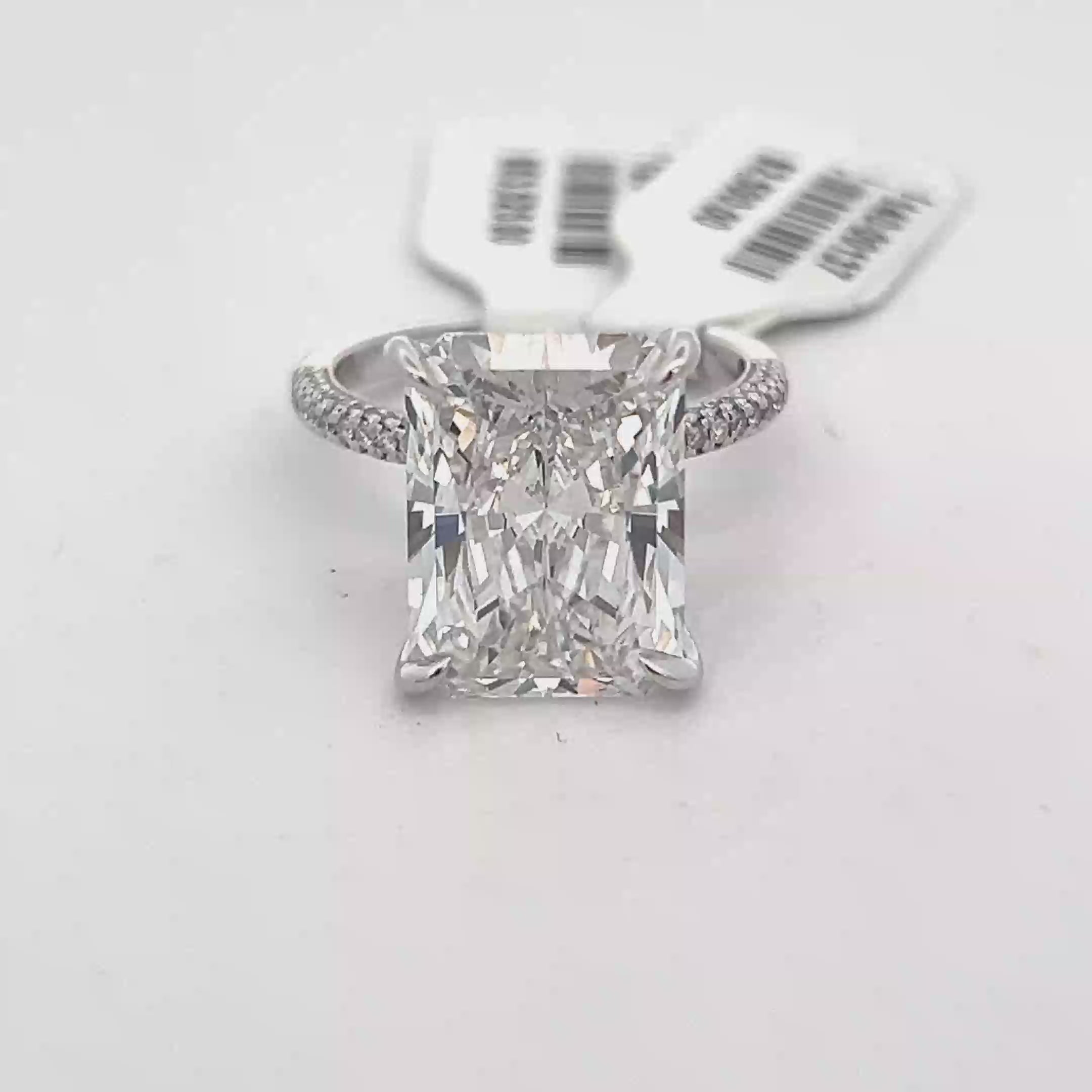 Radiant Diamond in a Halo Setting with Round Diamonds